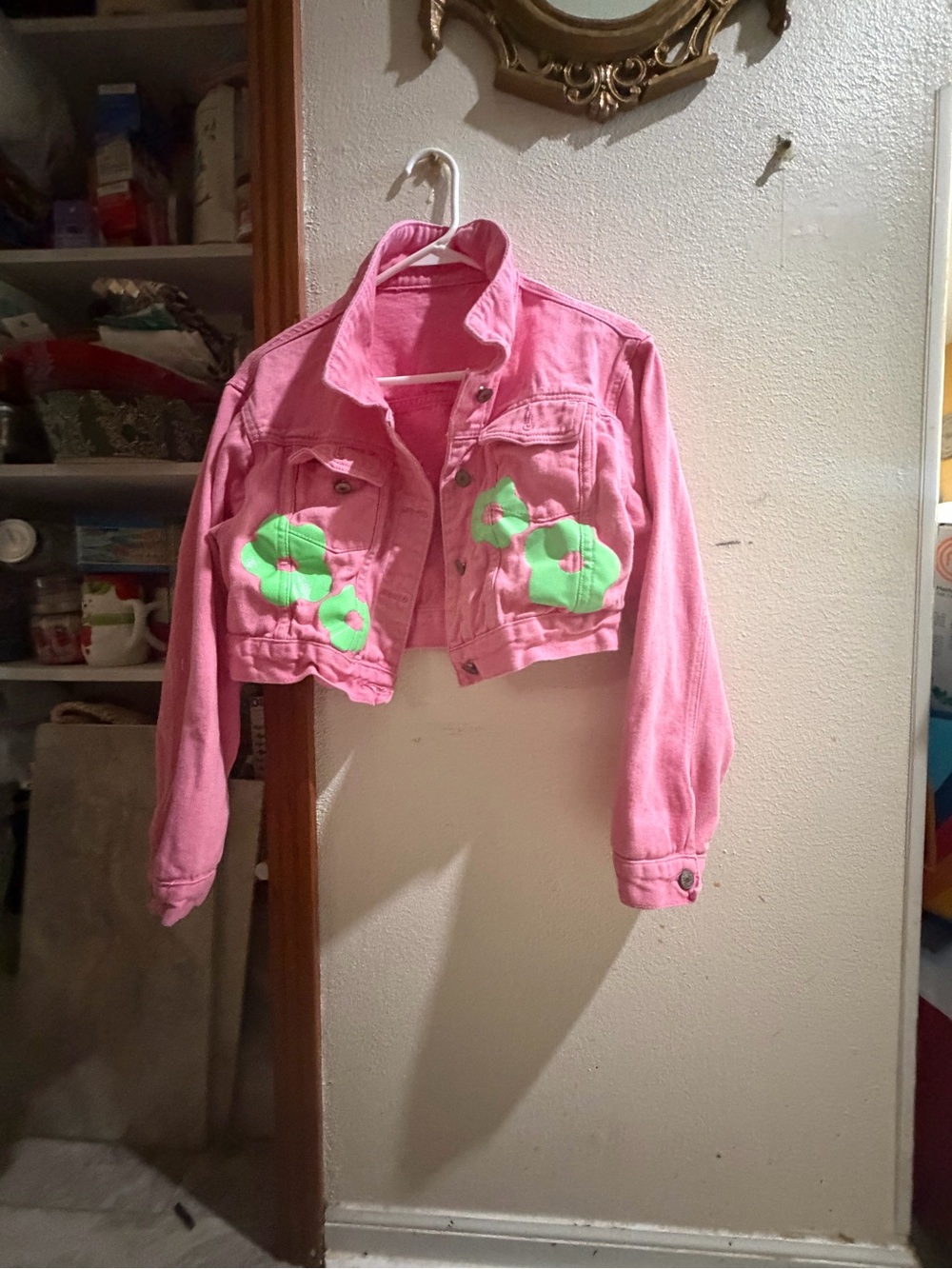 Pink cropped denim sweater.